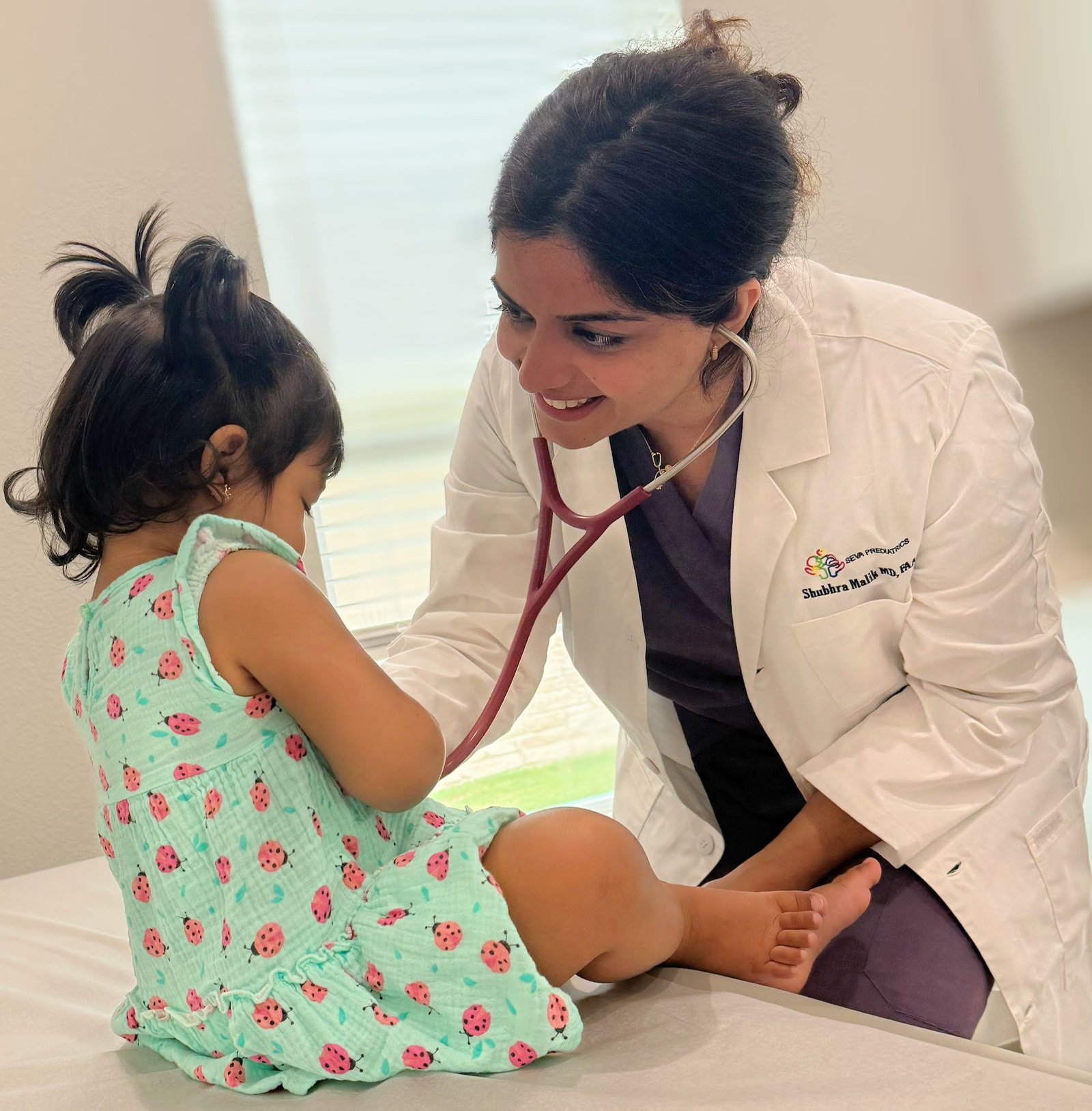 Pediatrician examining kid